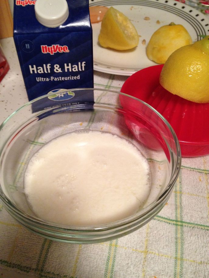 A bowl holds lemon juice and cream.